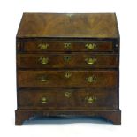 A 17th century and later walnut and crossbanded bureau,