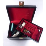 A jewellery box containing a mixed group of jewellery including a silver curblink chain suspending