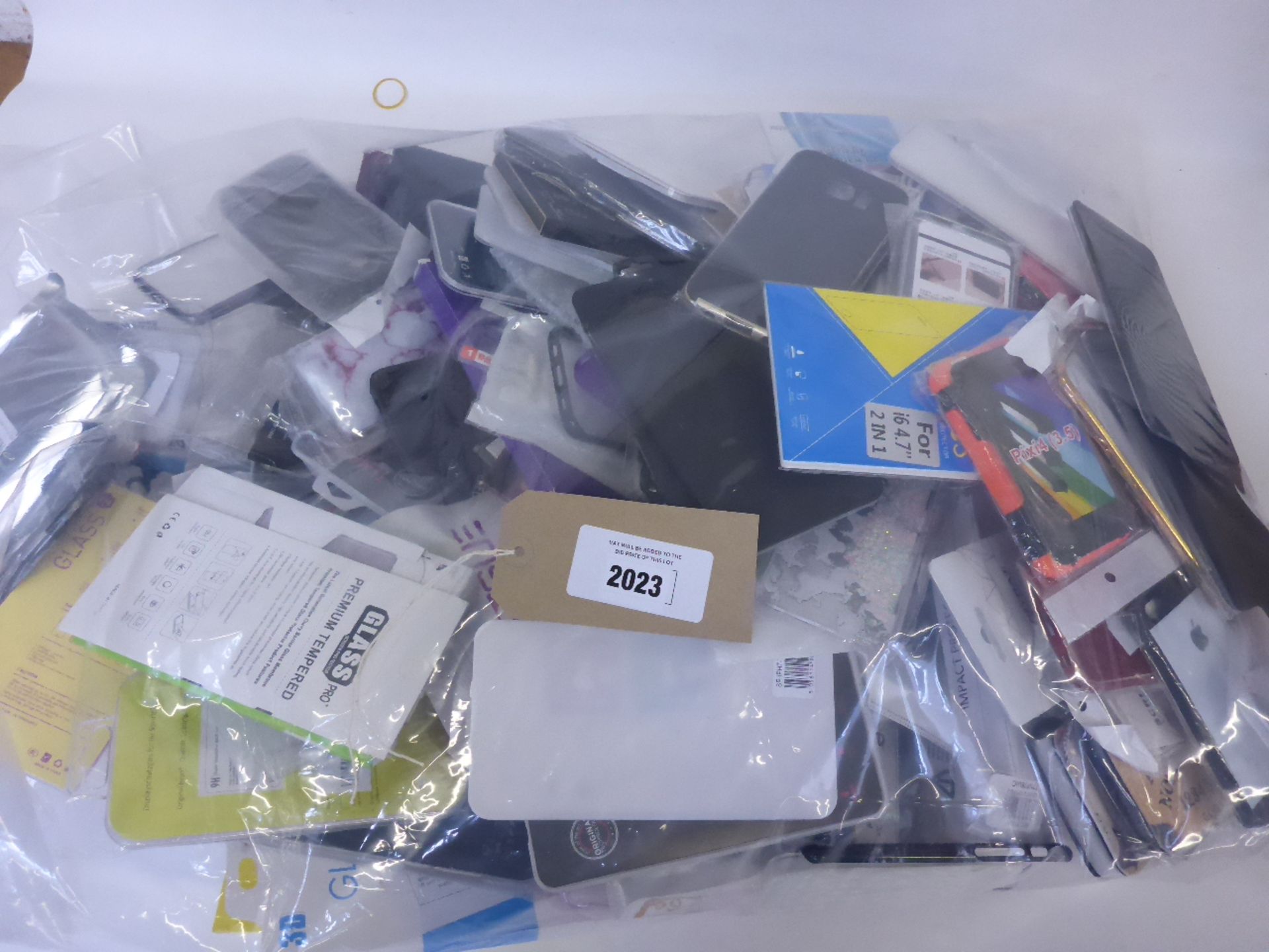 Bag containing small quantity of mobile phone covers and screen savers