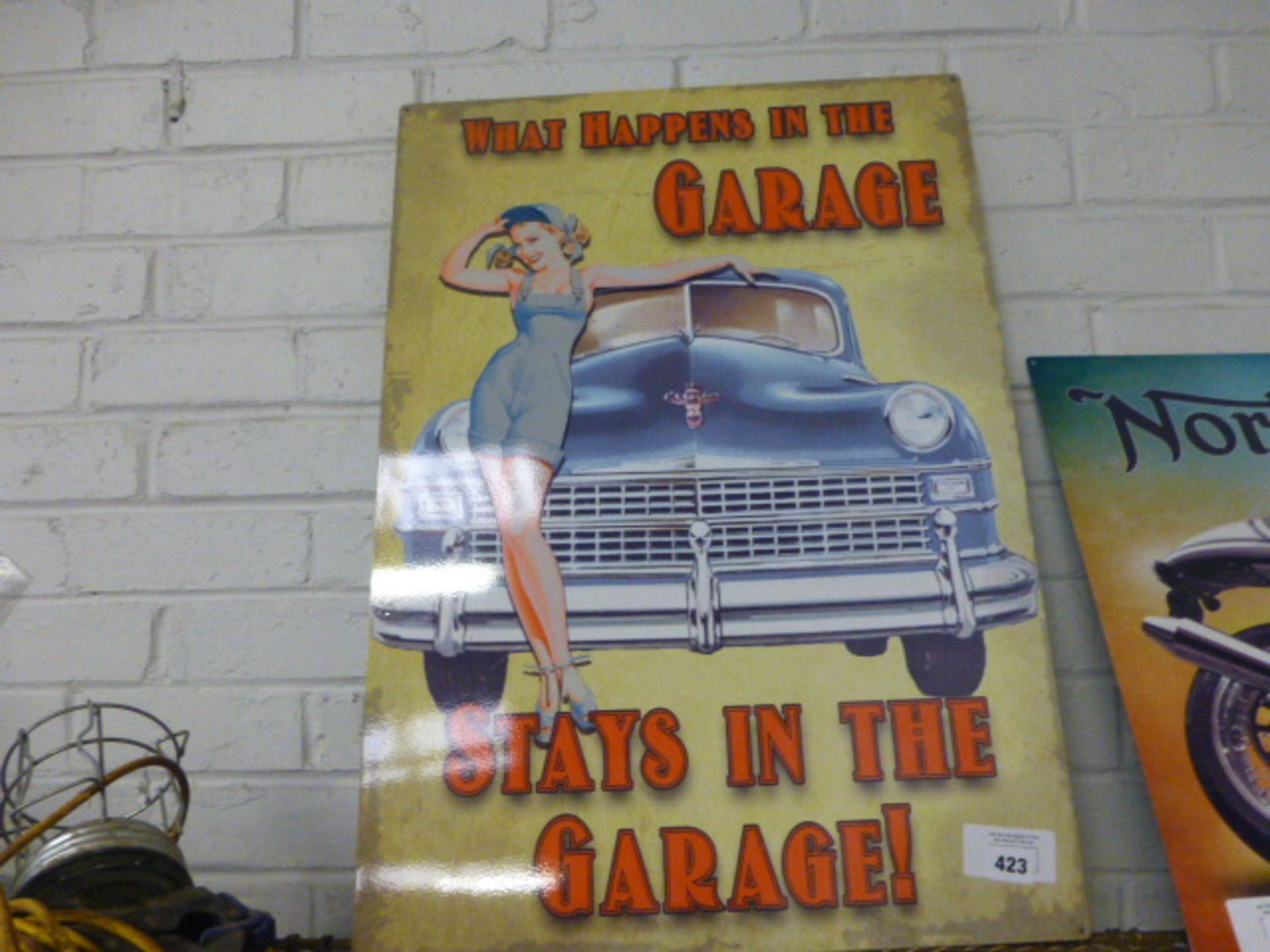 What happens in the garage stays in the garage metal sign (119)