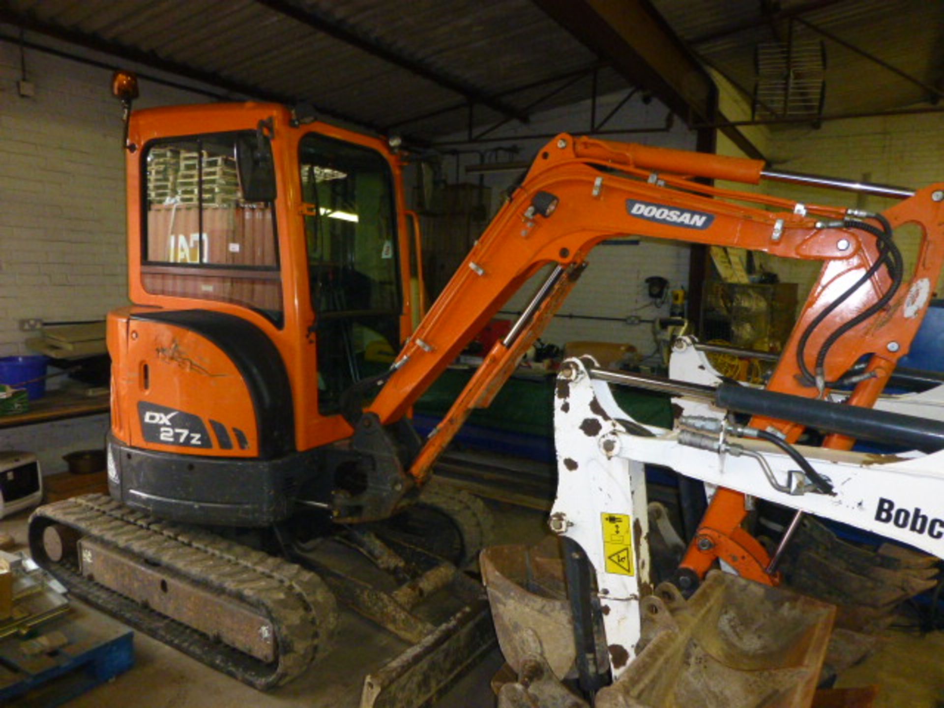 Doosan model DX27Z 3 tonne tracked excavator Year 2013 with 3 buckets, key start, showing 1671 hours