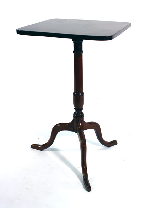 An 18th century mahogany square and tilt-top occasional table on a turned column and three splayed