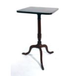 An 18th century mahogany square and tilt-top occasional table on a turned column and three splayed