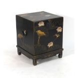 An early 20th century black and gilt lacquered box on stand decorated in the chinoiserie manner, w.