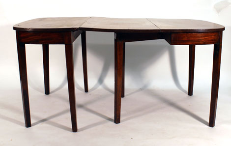 A George III mahogany D-end dining table with reeded sides on square tapering legs, l.