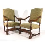 A pair of 18th century-type carved beech and upholstered armchairs