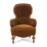 A Victorian mahogany and upholstered balloon back armchair on turned front legs CONDITION