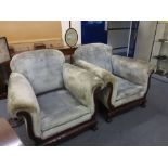 An early 20th century three piece upholstered suite with beech frames and ball and claw feet