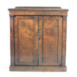 A 19th century mahogany cabinet, the two solid doors flanked by pilasters on a plinth base, w.
