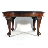 A Queen Anne-type mahogany and bevelled extending dining table, with two fitted leaves,