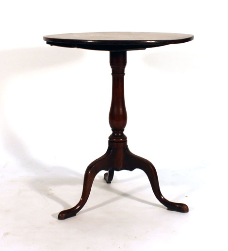 A George II oak tilt-top occasional table on a turned support with three splayed pad feet, d.