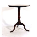 A George II oak tilt-top occasional table on a turned support with three splayed pad feet, d.