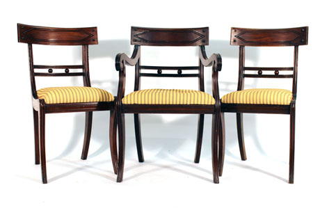 A set of eleven 19th century Regency-type mahogany and upholstered dining chairs including on