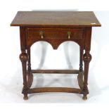 An 18th century oak lowboy,