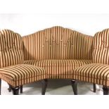 An 18th century style three piece suite upholstered in a red striped fabric with mahogany feet