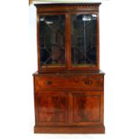 A 19th century mahogany and astral glazed secretaire bookcase on a plinth base, w.