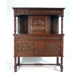 An early 20th century Continental carved oak court cupboard, dated 1603,