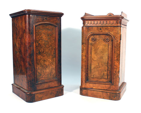 A pair of Victorian walnut pot cupboards with solid doors and plinth bases CONDITION