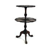 A 19th century mahogany two tier dumb waiter with moulded circular holders on three splayed feet, h.