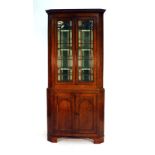 An 18th century and later oak corner cabinet,