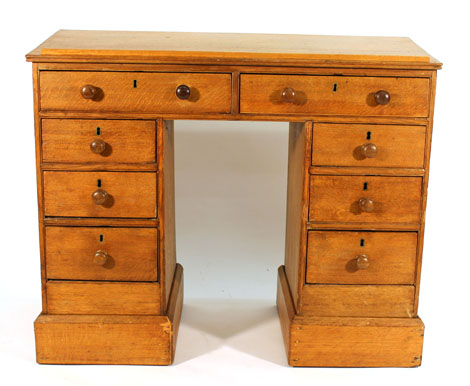 A late 19th/early 20th century oak desk,