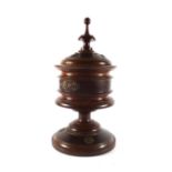 A 19th century walnut urn of classical form, h.