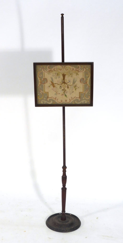 A 19th century mahogany pole screen with a rectangular tapestry depicting seated birds