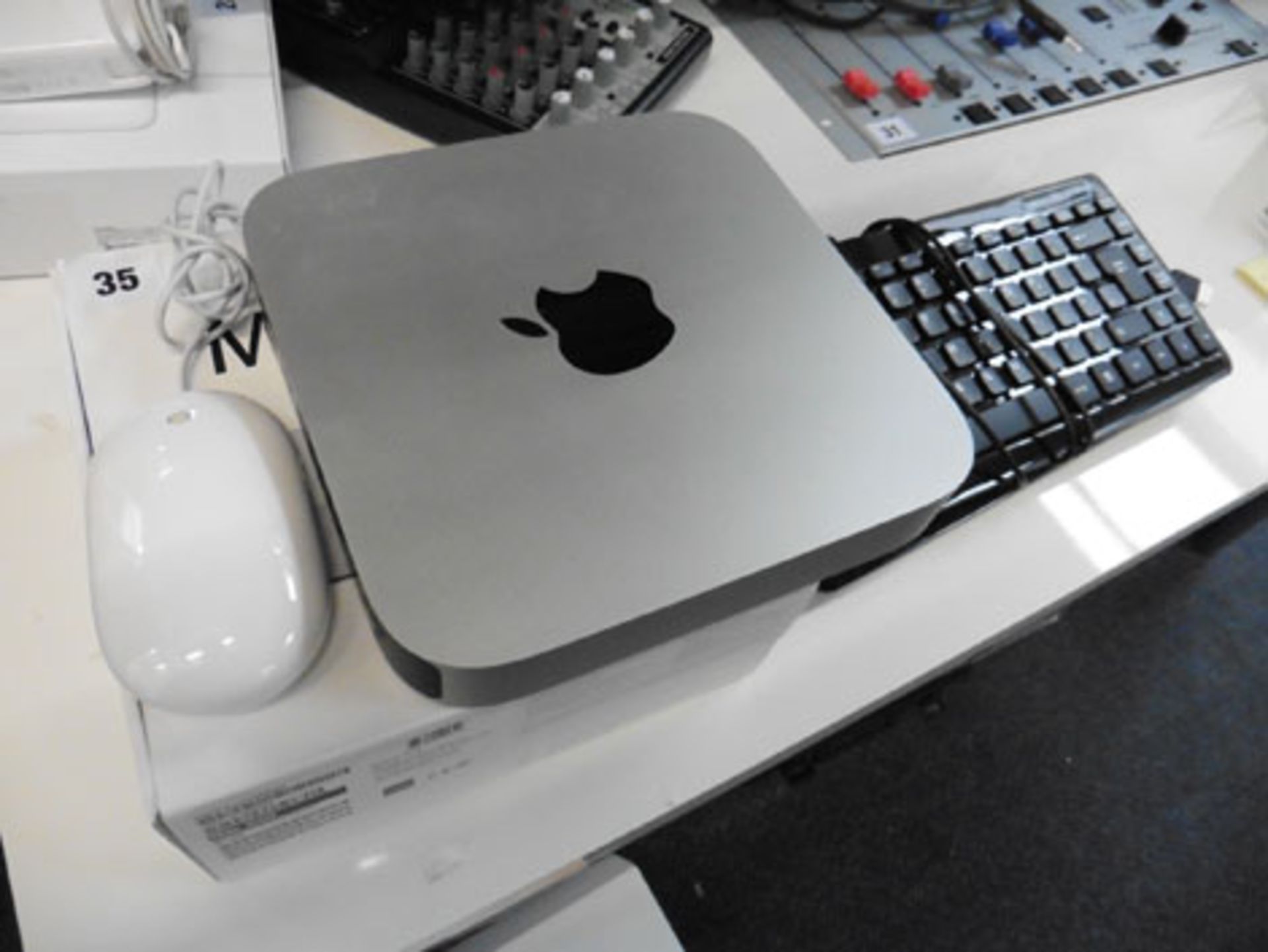 Apple mini computer Model A1347 dated 2012 along with a mouse and 2 keyboards *VAT will not be added