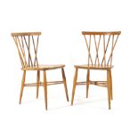 A pair of Ercol elm and beech dining chairs with criss-cross spindle backs CONDITION