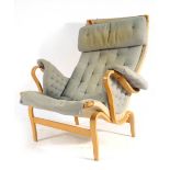 A beech and button upholstered 'Pernilla' armchair by Bruno Mathsson CONDITION REPORT: