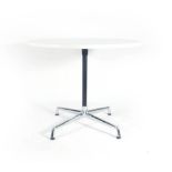 Charles and Ray Eames for Vitra, a white circular bistro table on an aluminium four-star base, d.