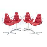 A set of four 1960's red and white button upholstered armchairs with chromed frames on four star