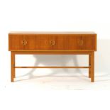 A Danish teak three drawer side cabinet on square oak legs joined by a cross stretcher, l. 90.