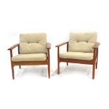 A pair of 1970's teak armchairs with loose cushions in the manner of France & Sons