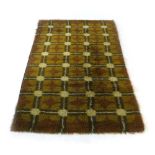 A 1970's green woollen floor rug,