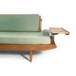 A late 1950's/early 1960's 'Wentworth' afromosia teak day bed with copper piping and supports and