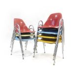 A set of seven American coloured fibreglass and tubular stacking chairs by Borg-Warner