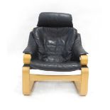 A 1960/70's 'Kroken' chair with black leather upholstery and an oak frame by Ake Fribytter