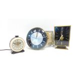 A 1960/70's West German clock by Kaiser, together with three 1950's-70's clocks by Ferranti,