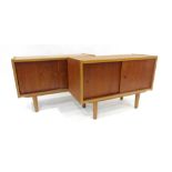 A pair of 1960/70's teak cabinets with solid sliding doors, w.