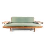 A late 1950's/early 1960's 'Wentworth' afromosia teak day bed with copper piping and supports and