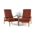 A pair of Greaves and Thomas afromosia and button upholstered reclining armchairs