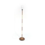 A 1970's teak and brass coloured standard lamp CONDITION REPORT: Working order