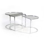 A 1970's glass and chrome semi-circular set of three nesting tables, max. w.