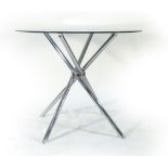 A 1970's circular table on a chrome base, d.