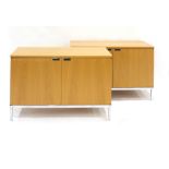 A pair of Florence Knoll oak two door credenza on chromed square feet, w.