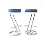 A pair of 1930's-type chromed and upholstered bar stools