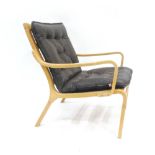 A Danish beech bentwood armchair with brown button cushions by Skippers Mobler