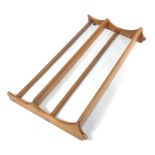 An Ercol three tier elm plate rack, w.