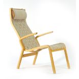 A Scandinavian beech high back armchair with a webbed seat and attached headrest in the manner of